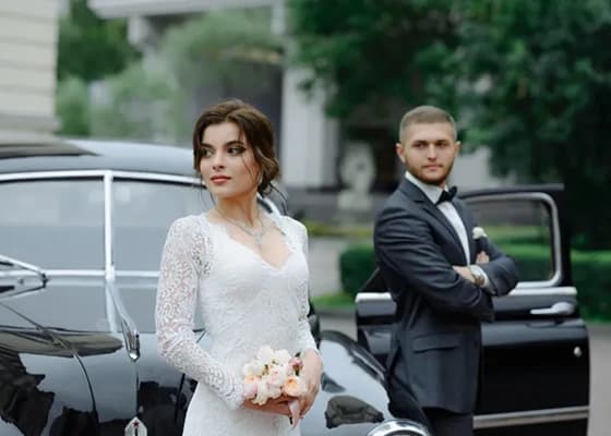 Wedding car with the happy couple