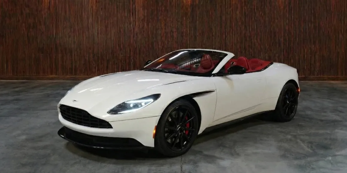White Aston Martin DB11 exterior with convertible roof for sports car rental