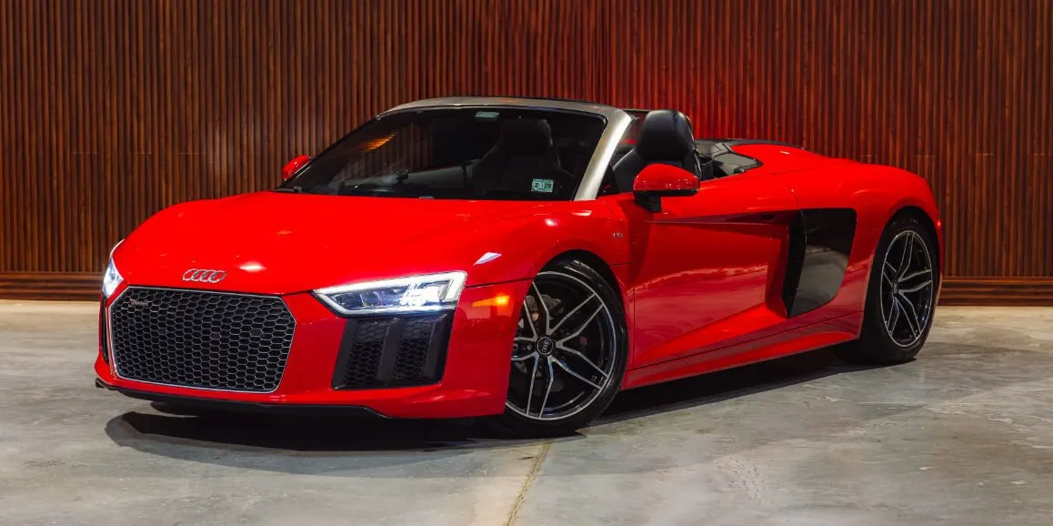 Red Audi R8 with convertible roof for sports car rental