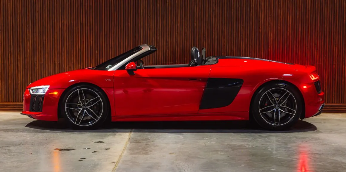 Red Audi R8 exterior with convertible roof for sports car rental