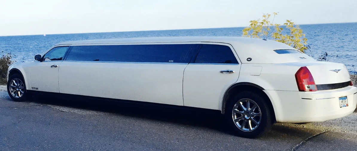 White C300 Limousine exterior with tinted windows, photo 3 for limo rental