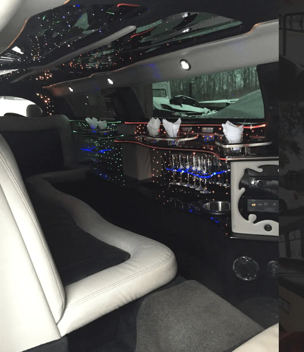 C300 Limousine interior with LED accent lighting, starlight or fiber-optic ceiling and bar area for limo rental