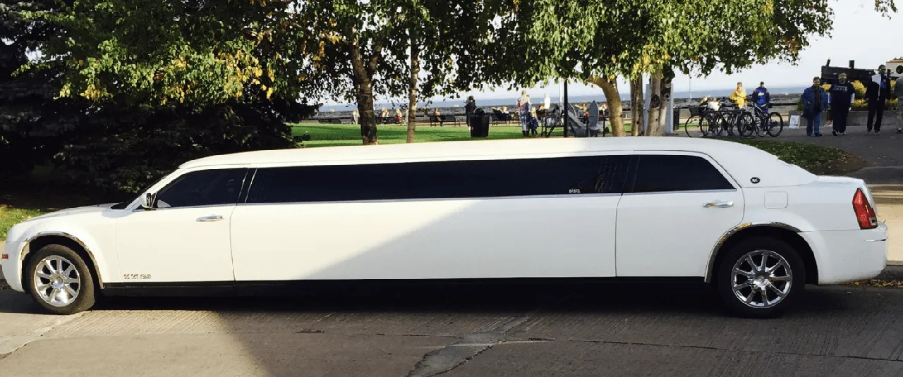 White C300 Limousine exterior with tinted windows for limo rental