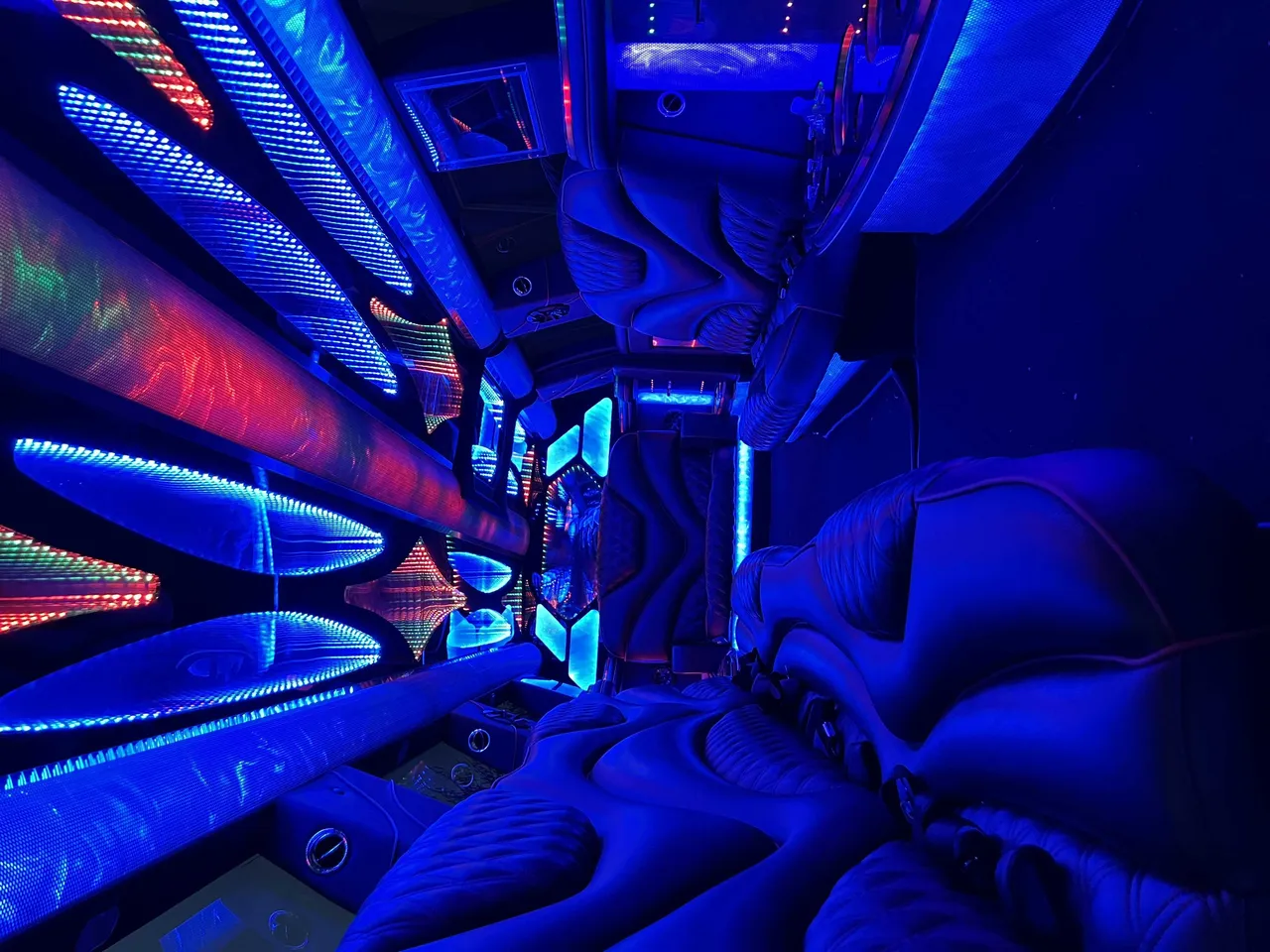Cadillac Escalade Limo interior with LED accent lighting and LED ceiling lighting for limo rental