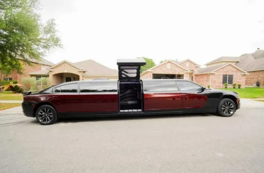 Black Charger Limo with tinted windows and bridal (jet) door for limo rental