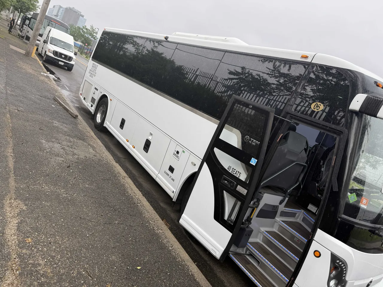 40 Passenger Charter Bus White 40 Passenger Charter Bus with tinted windows for charter bus rental