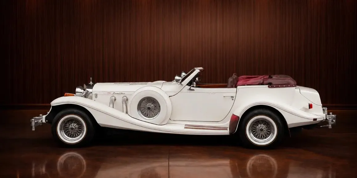 White Excalibur Phaeton (Vintage) exterior with convertible roof for wedding car rental