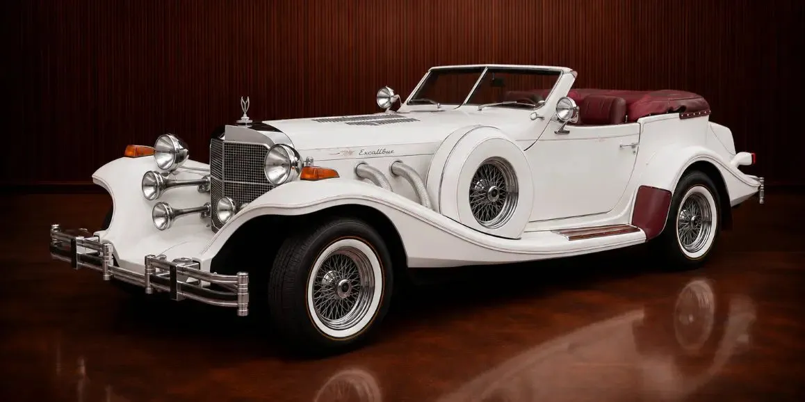 White Excalibur Phaeton (Vintage) with convertible roof for wedding car rental