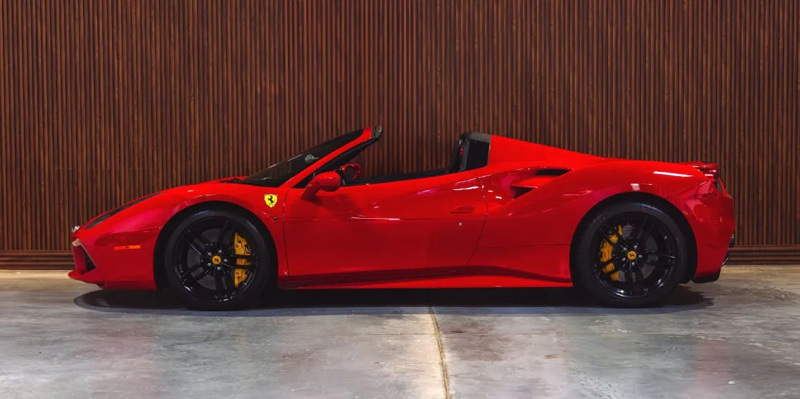 Red Ferrari 488 Spider exterior with convertible roof for sports car rental