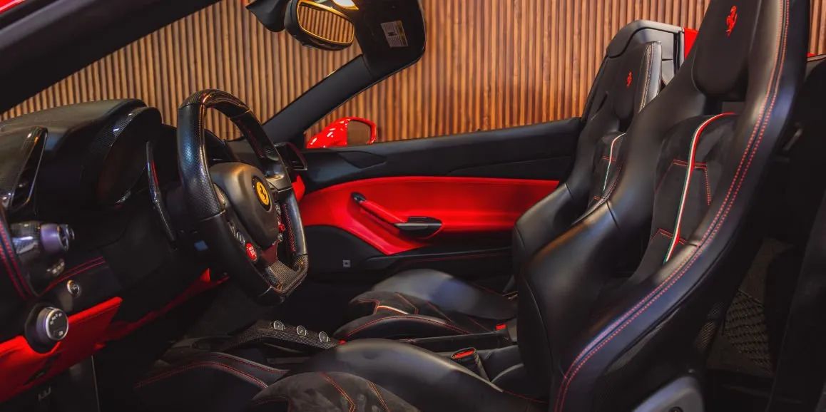 Ferrari 488 Spider interior with convertible roof for sports car rental