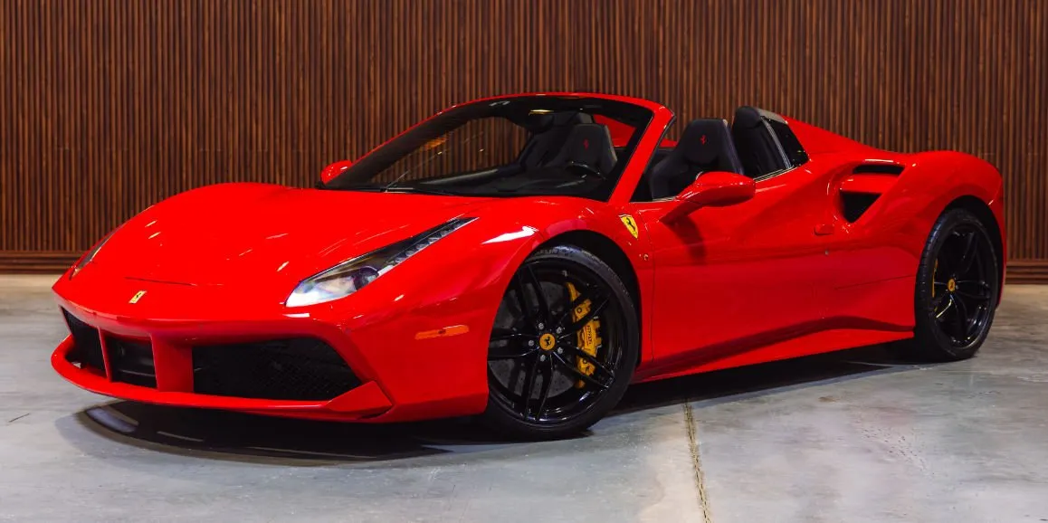 Ferrari 488 Spider Red Ferrari 488 Spider with convertible roof for sports car rental