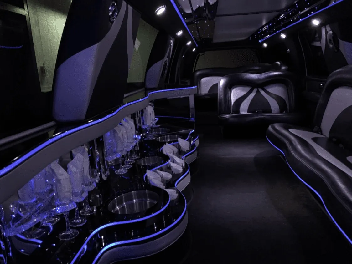 Ford Excursion Limousine interior with LED accent lighting and bar area for limo rental