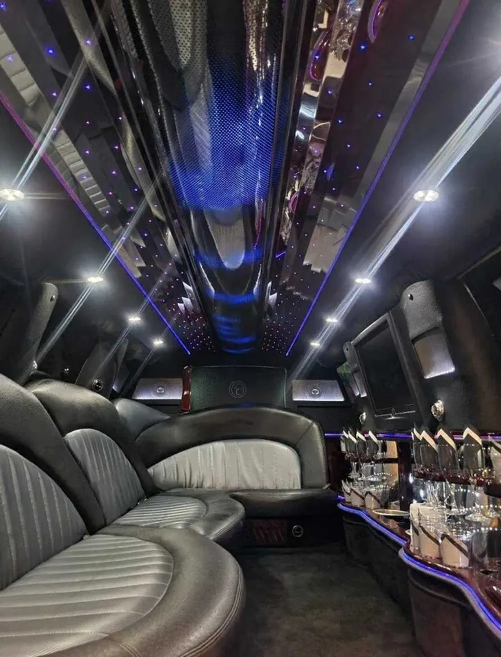 Ford Expedition Limo interior with LED accent lighting, starlight or fiber-optic ceiling and mirrored ceiling for limo rental