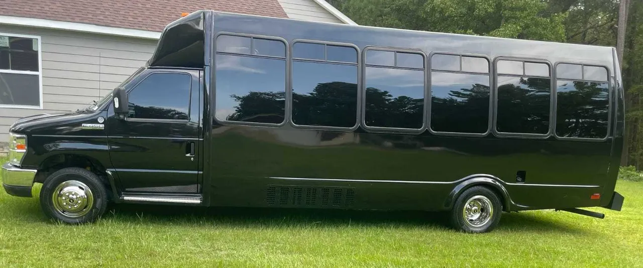 Black Ford Party Bus exterior with tinted windows for party bus rental