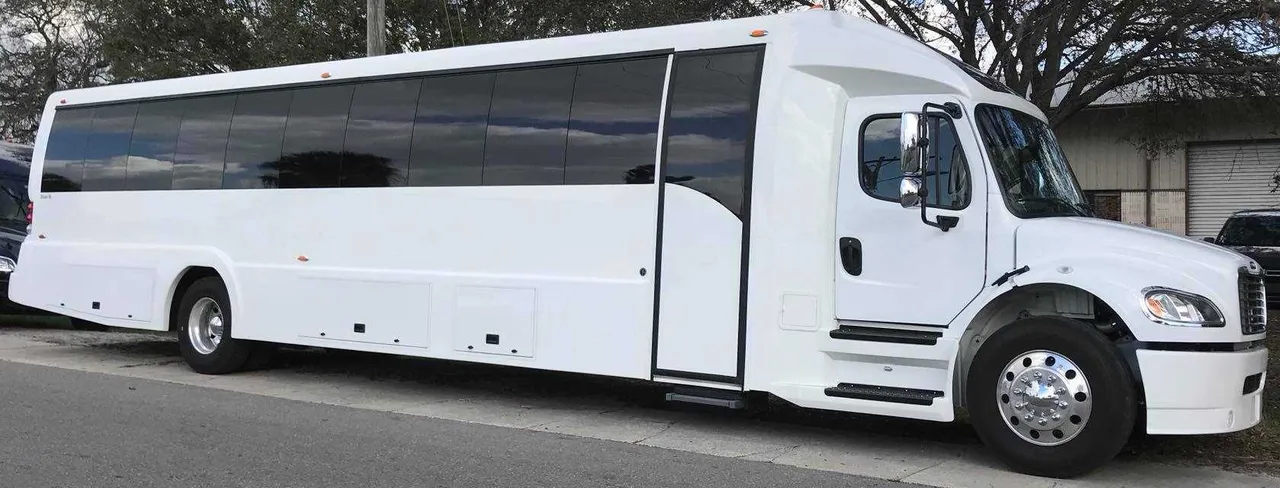 Freightliner Luxury Coach White Freightliner Luxury Coach with tinted windows for charter bus rental