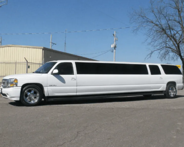 White GMC Denali Limousine exterior with tinted windows, photo 3 for limo rental