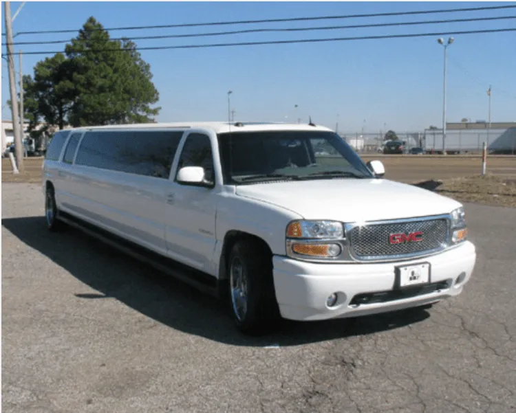 White GMC Denali Limousine with tinted windows for limo rental