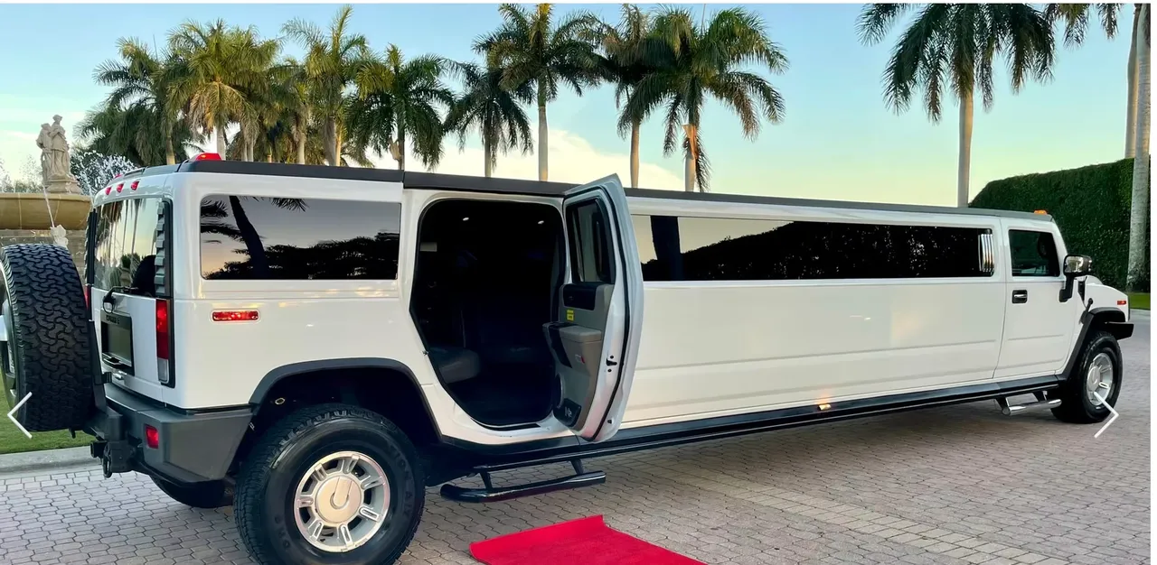 Hummer H2 15 Pass White Hummer H2 15 Pass with tinted windows and running boards for limo rental
