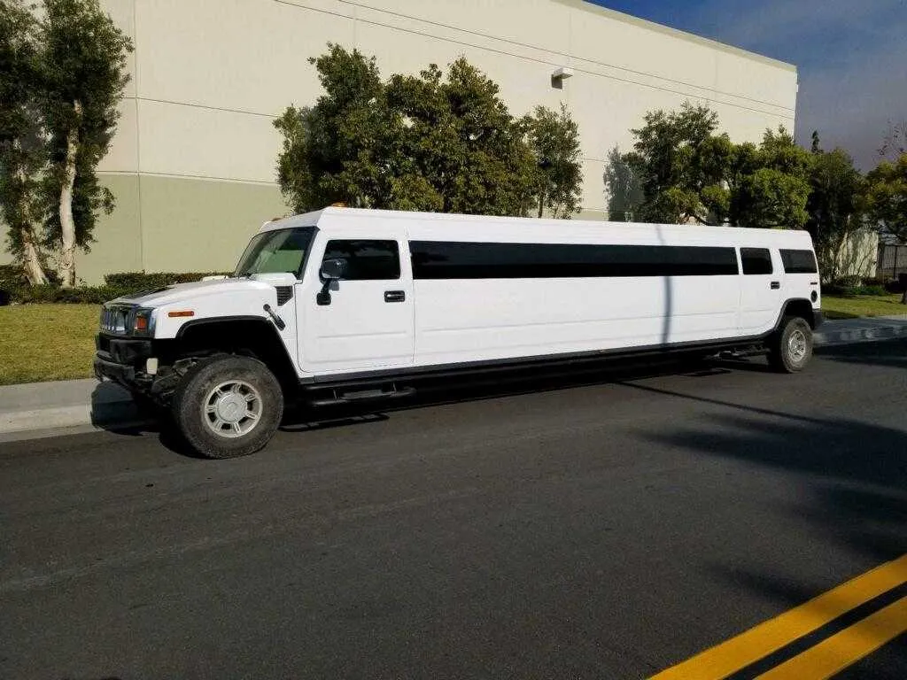 White Hummer Limo with tinted windows for limo rental