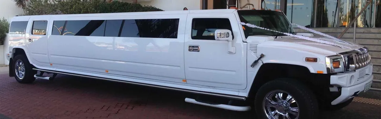 White Hummer Limo for limo rental