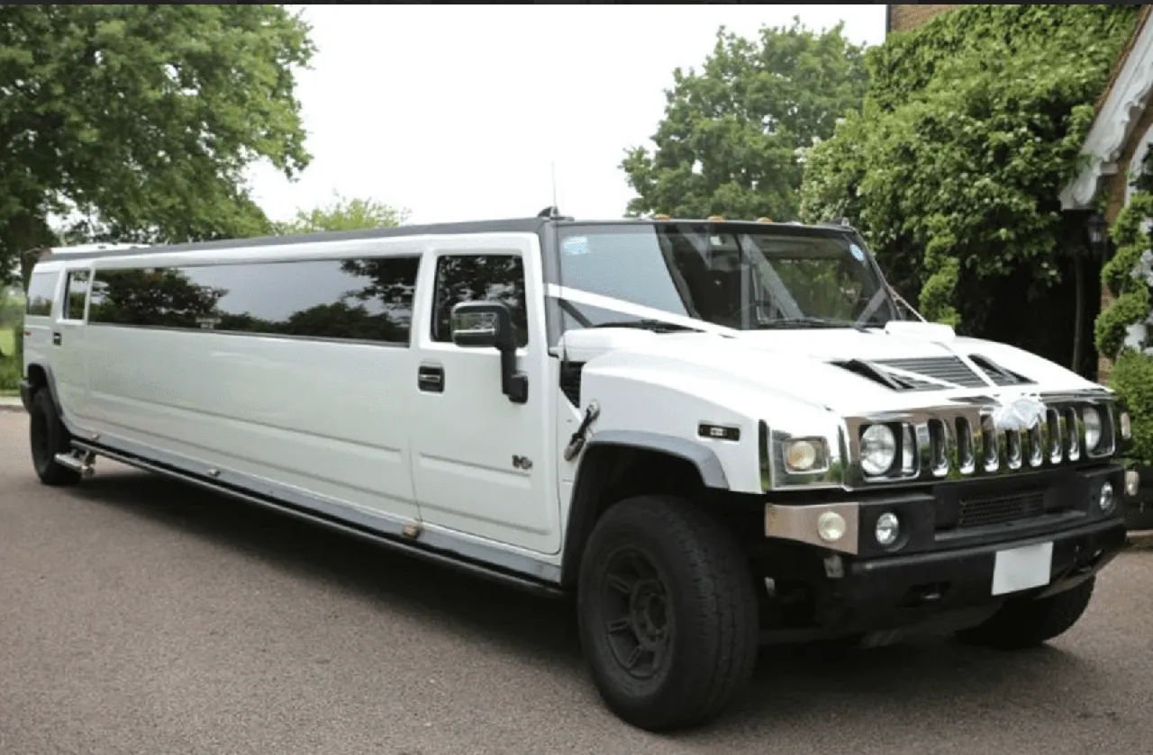 White Hummer Limo with tinted windows for limo rental