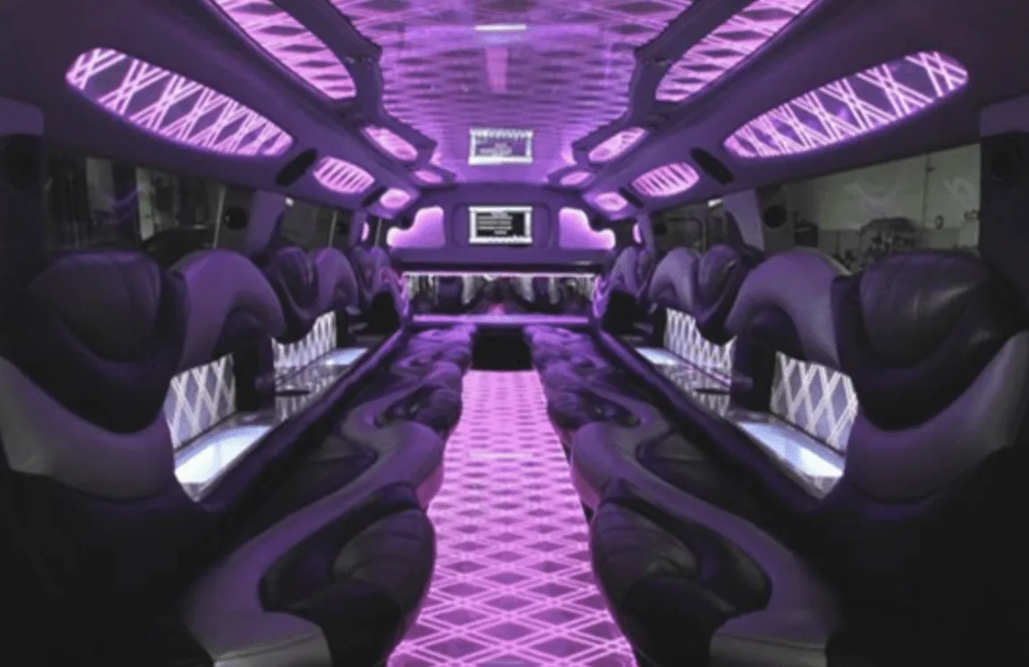 Hummer Limousine interior with perimeter lounge seating, LED accent lighting and LED ceiling lighting for limo rental