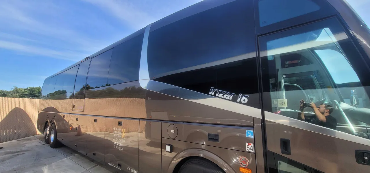 Brown Irizar Motorcoach exterior with tinted windows for charter bus rental