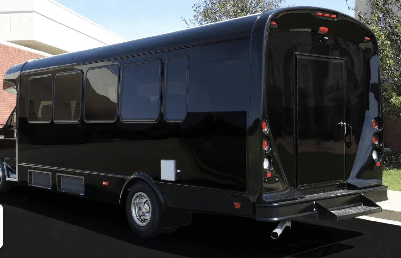 Black 22 Passenger Limo Coach exterior with tinted windows for party bus rental
