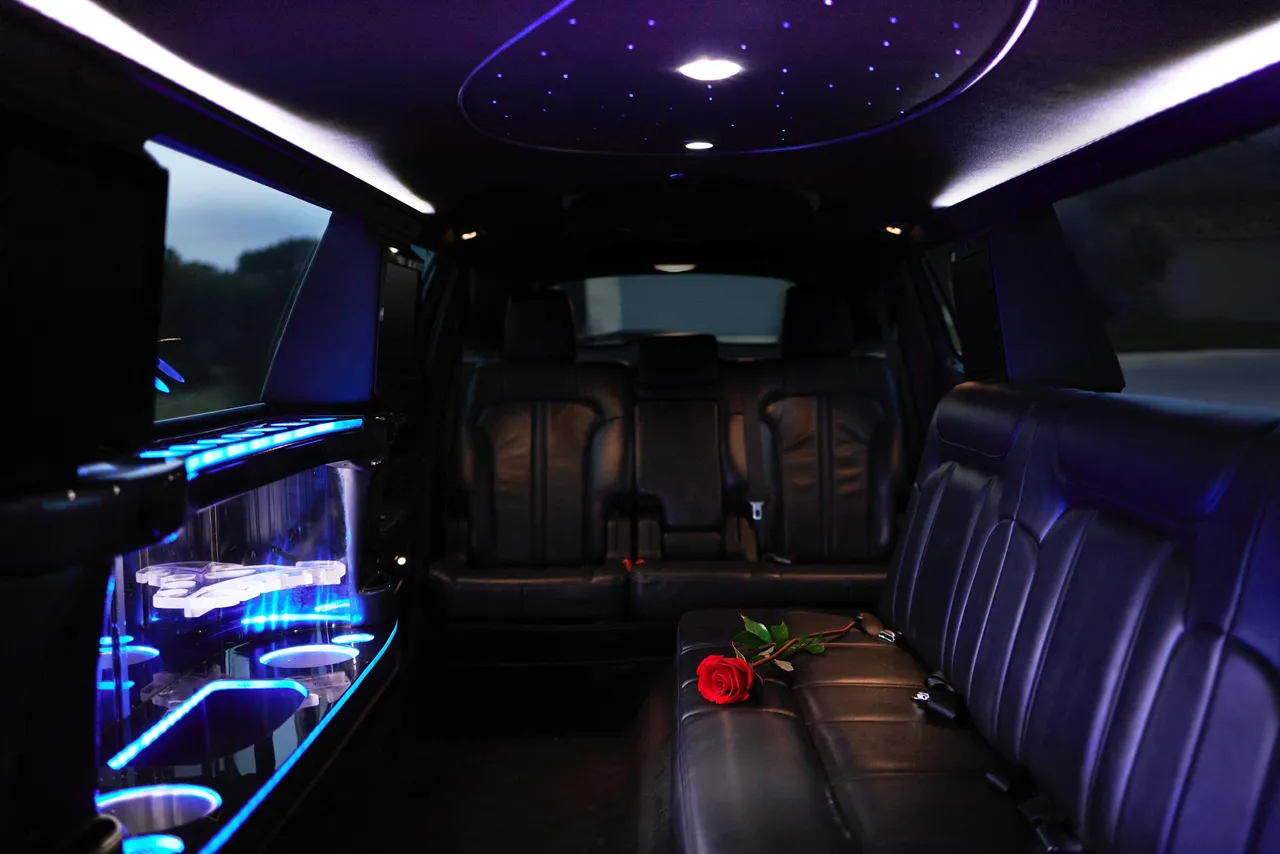 Lincoln MKT Limo interior with LED accent lighting, starlight or fiber-optic ceiling and bar area for limo rental