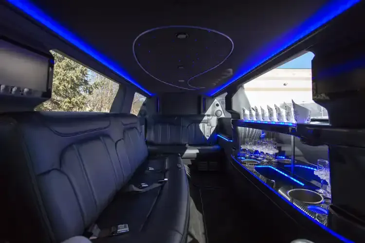 Lincoln MKT Limo interior with LED accent lighting, starlight or fiber-optic ceiling and bar area for limo rental