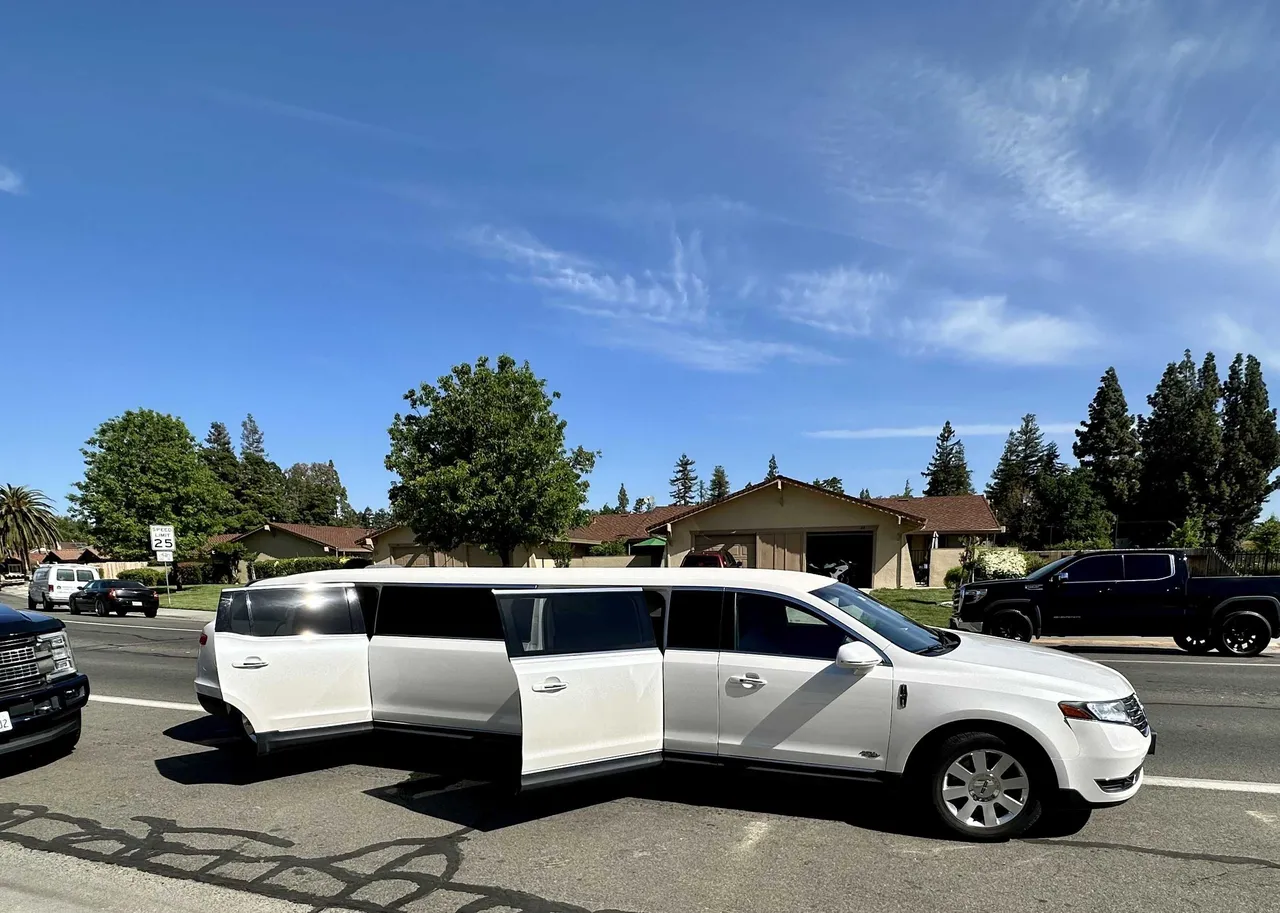 White Lincoln MKT Limo exterior, photo 3 for limo rental