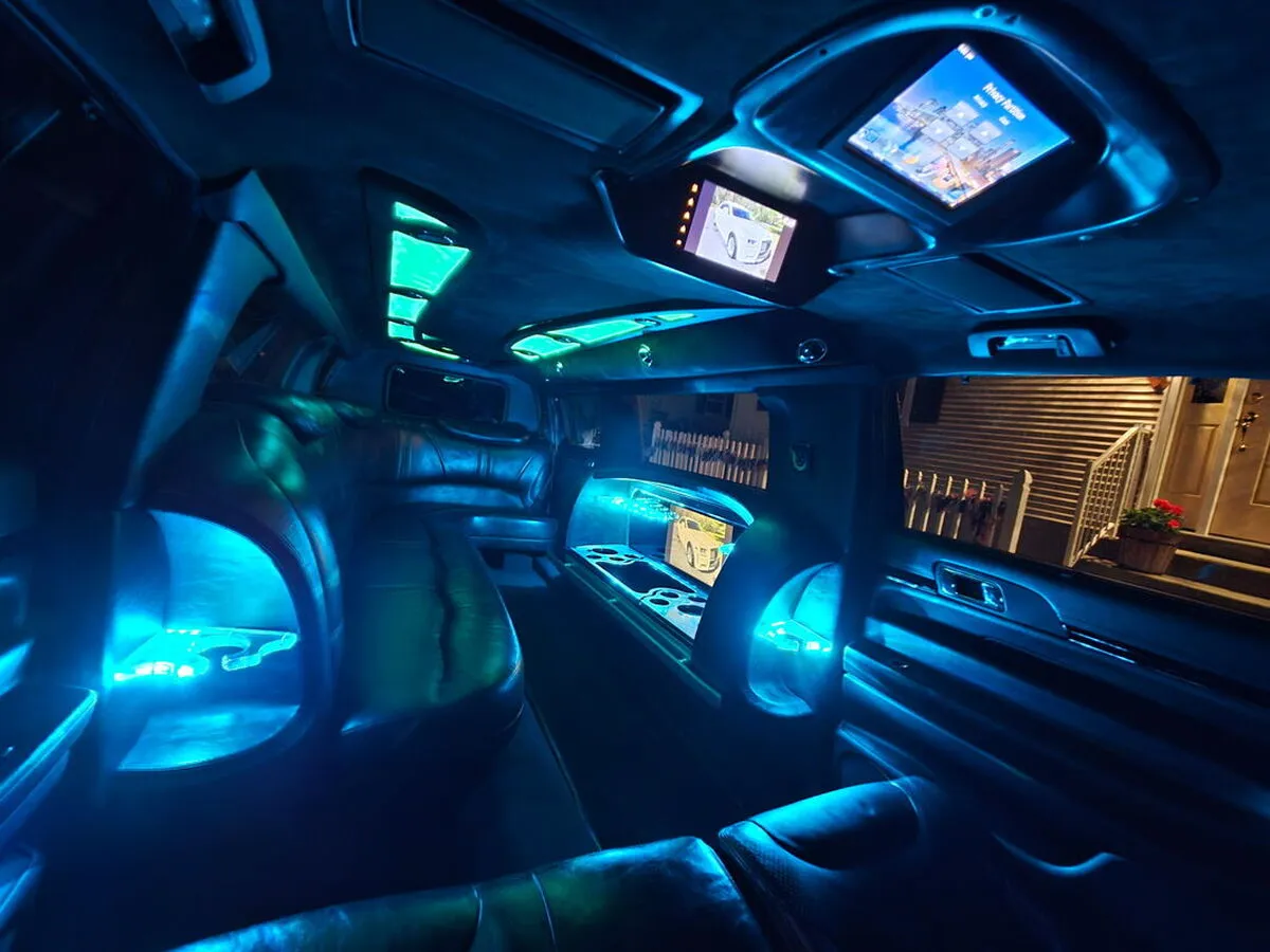 Lincoln MKT Limousine Lincoln MKT Limousine interior with LED accent lighting and TV screens for limo rental