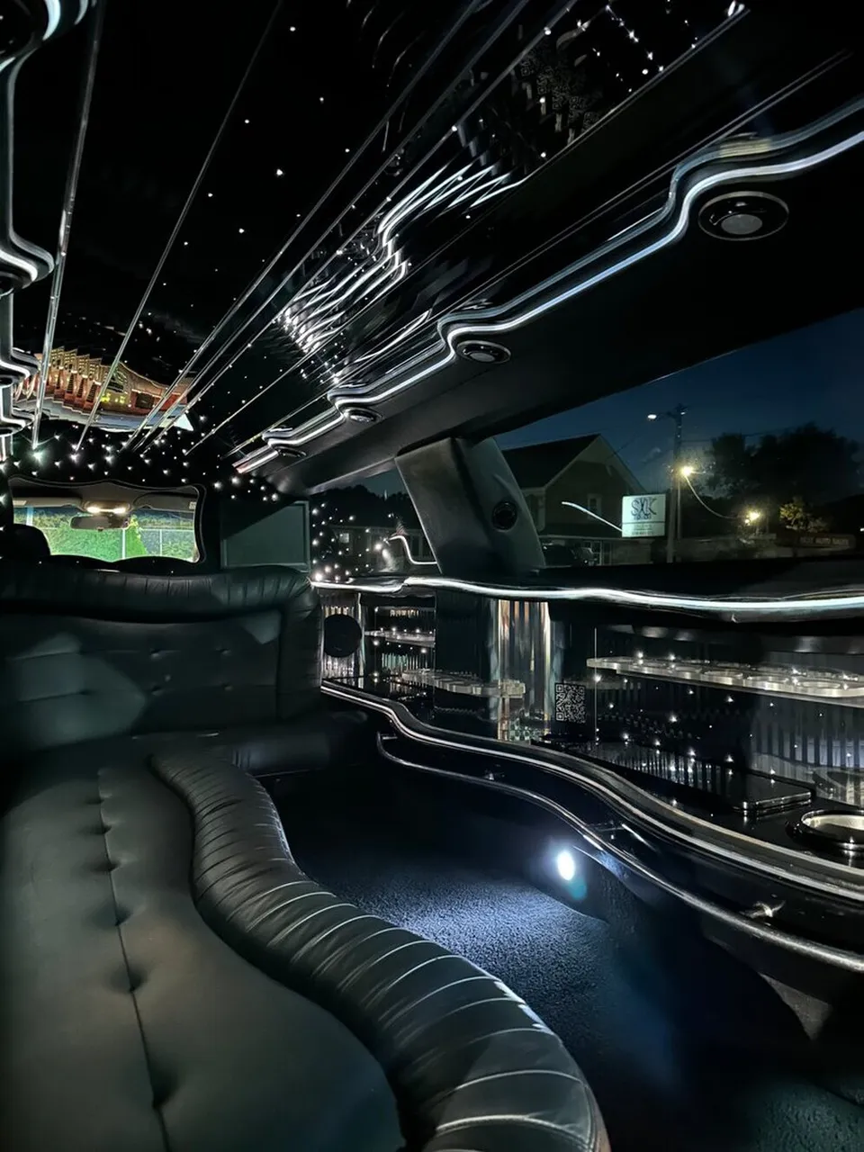 Lincoln Town Car Limousine interior with sofa-style seating, LED accent lighting and starlight or fiber-optic ceiling, photo 12 for limo rental