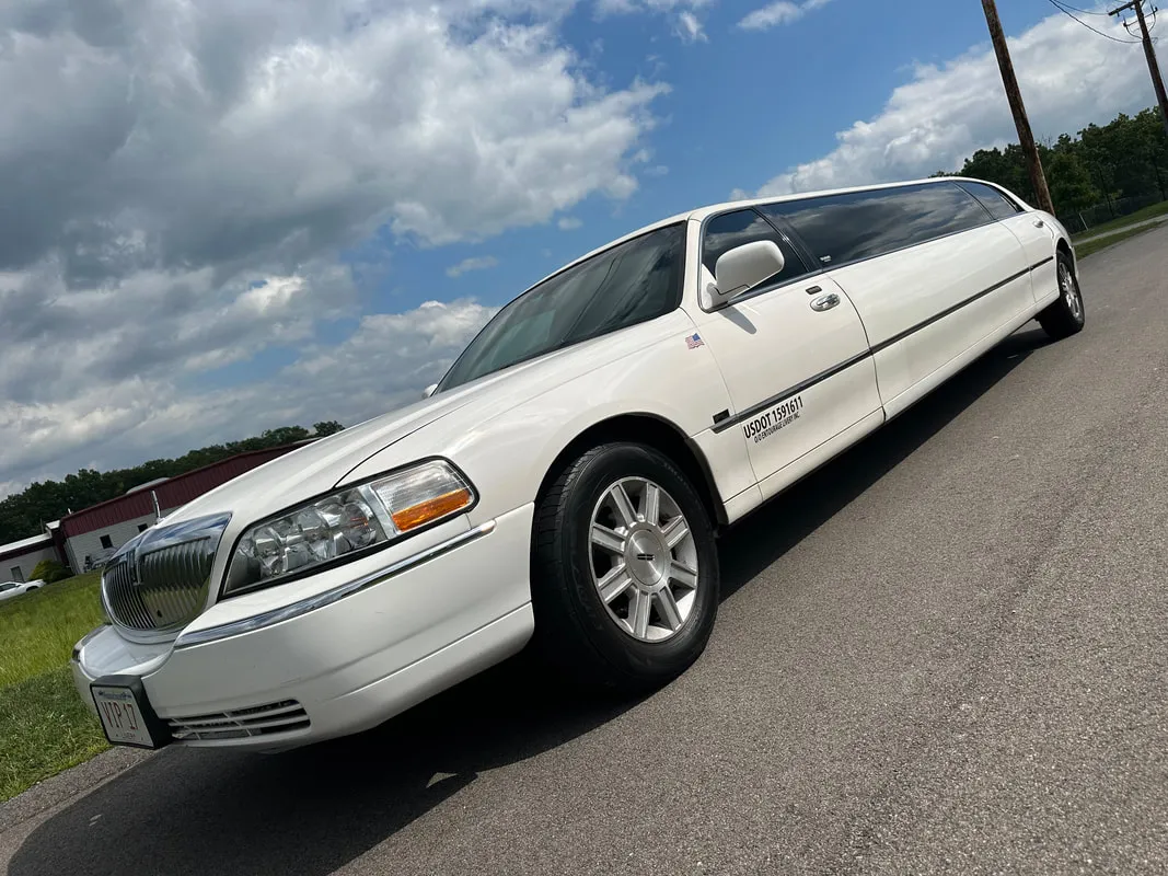 White Lincoln Town CAR Limousine exterior with tinted windows for limo rental