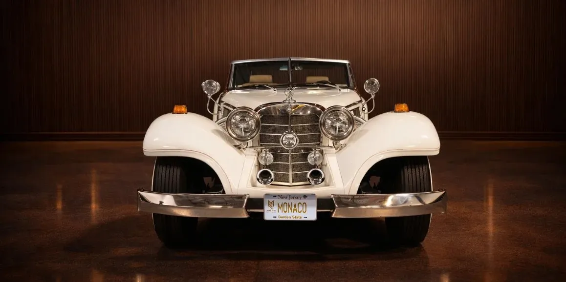 White Mercedes Benz 500k exterior with convertible roof for wedding car rental
