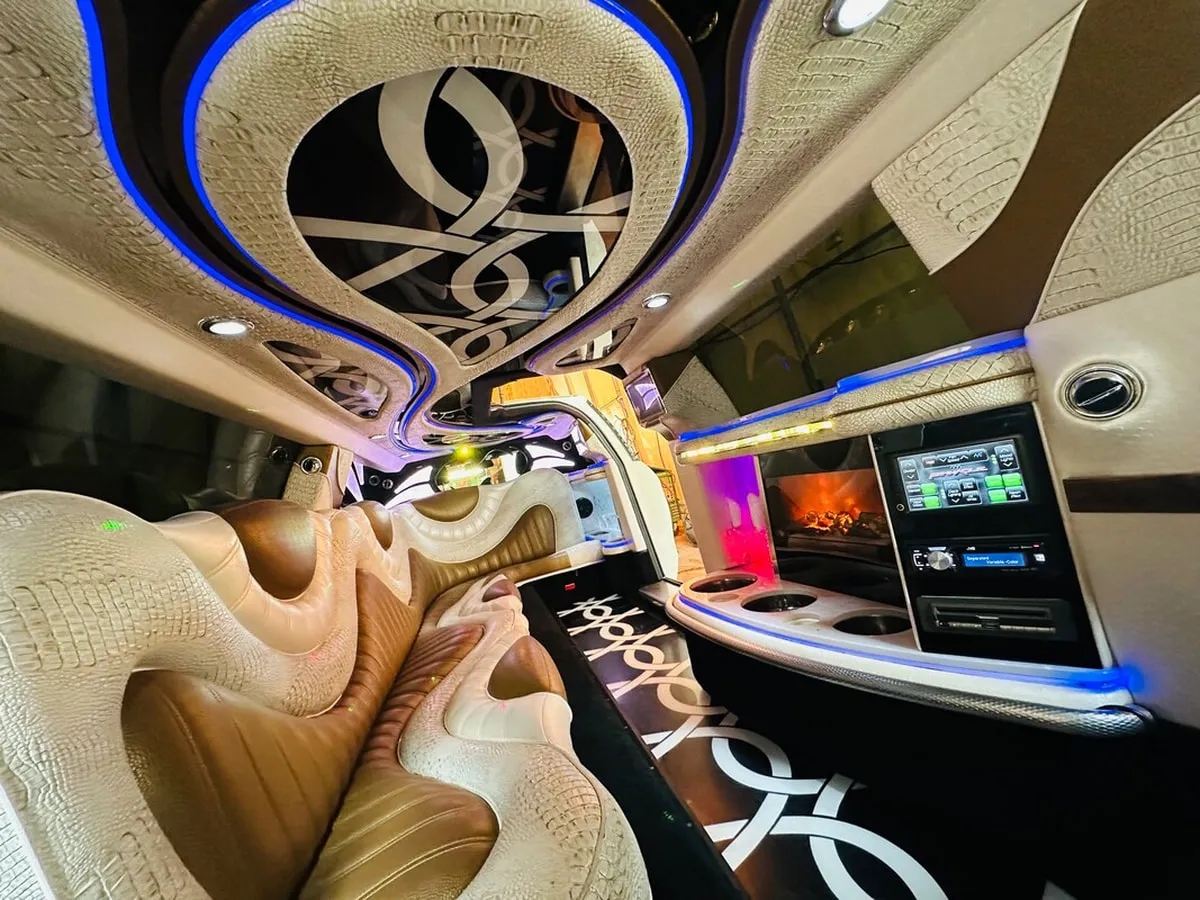 Mercedes-Benz Jet Doors Limousine interior with perimeter lounge seating and LED accent lighting, photo 11 for limo rental