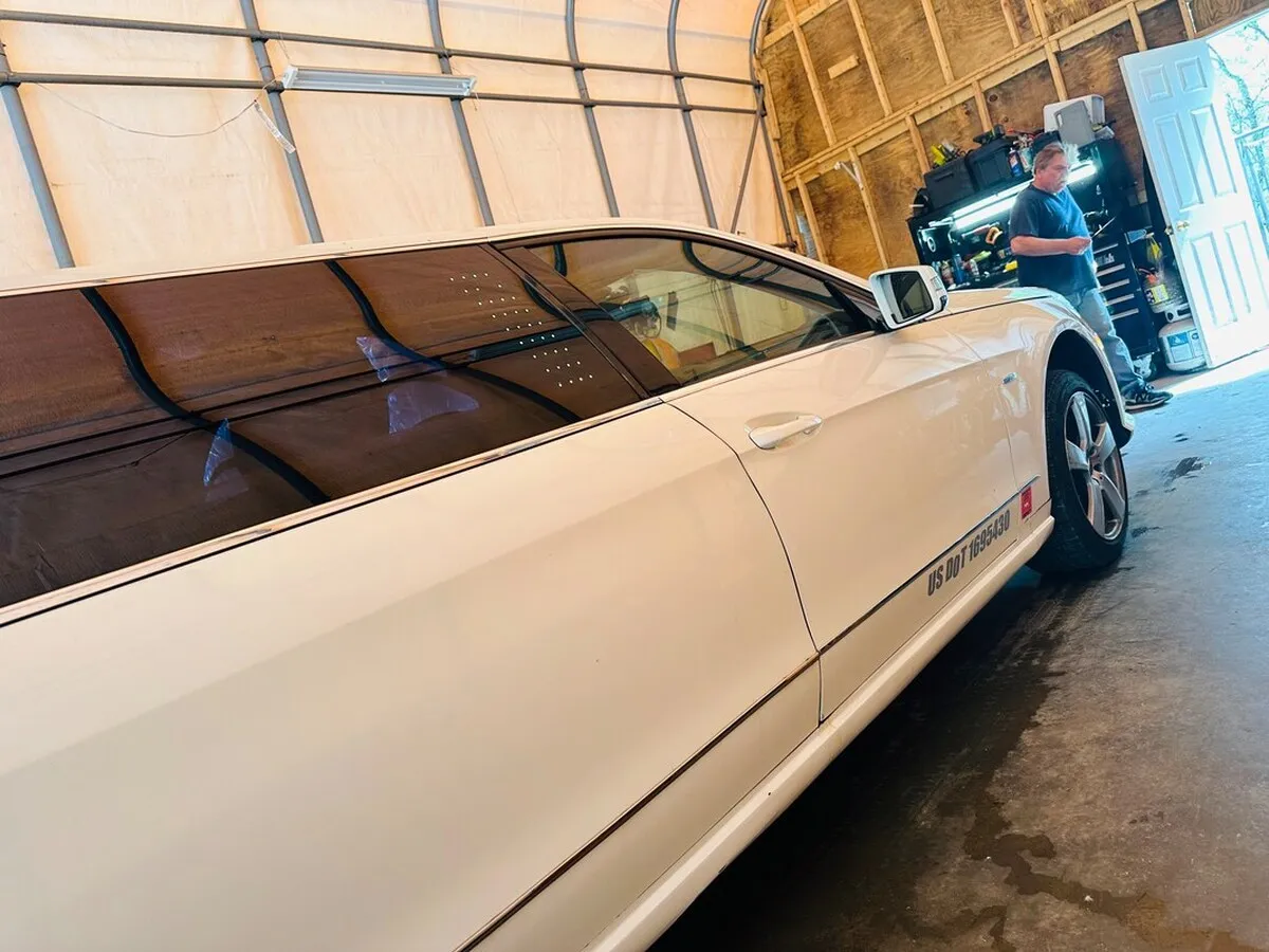 White Mercedes JET Doors Limousine exterior with tinted windows, photo 6 for limo rental