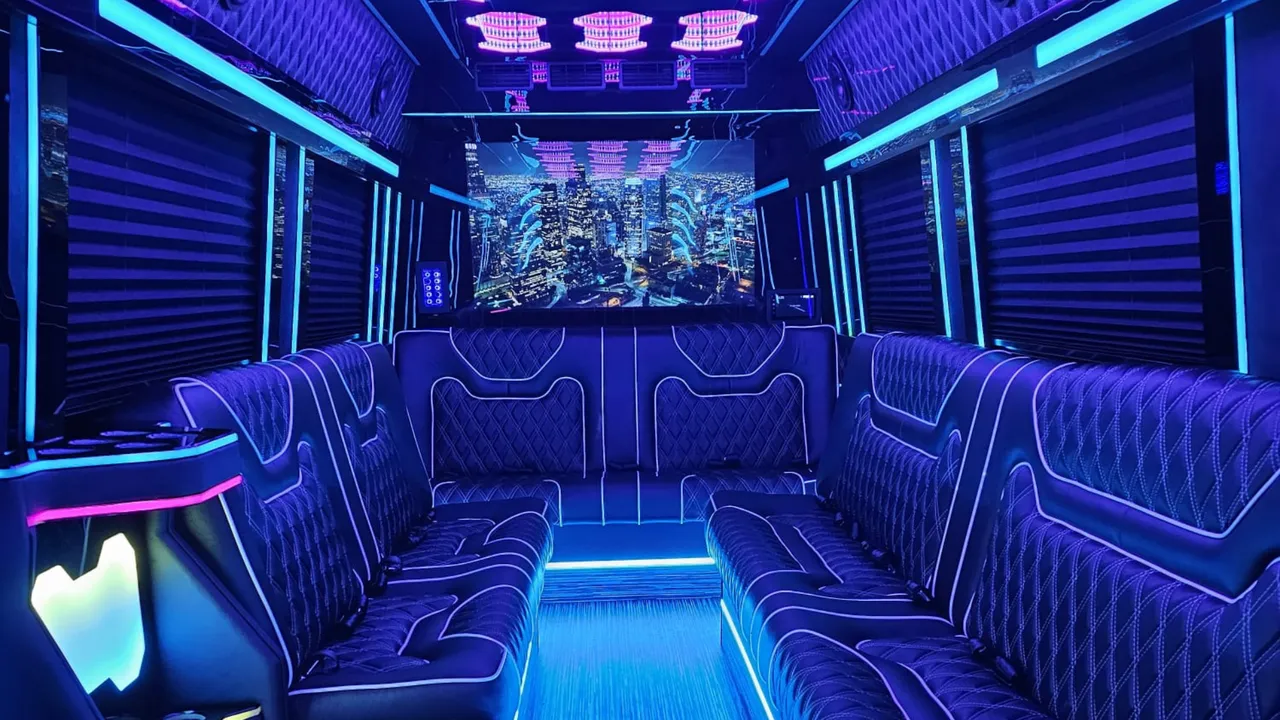 Mercedes Limo Sprinter interior with perimeter lounge seating, sofa-style seating and window shades for party bus rental