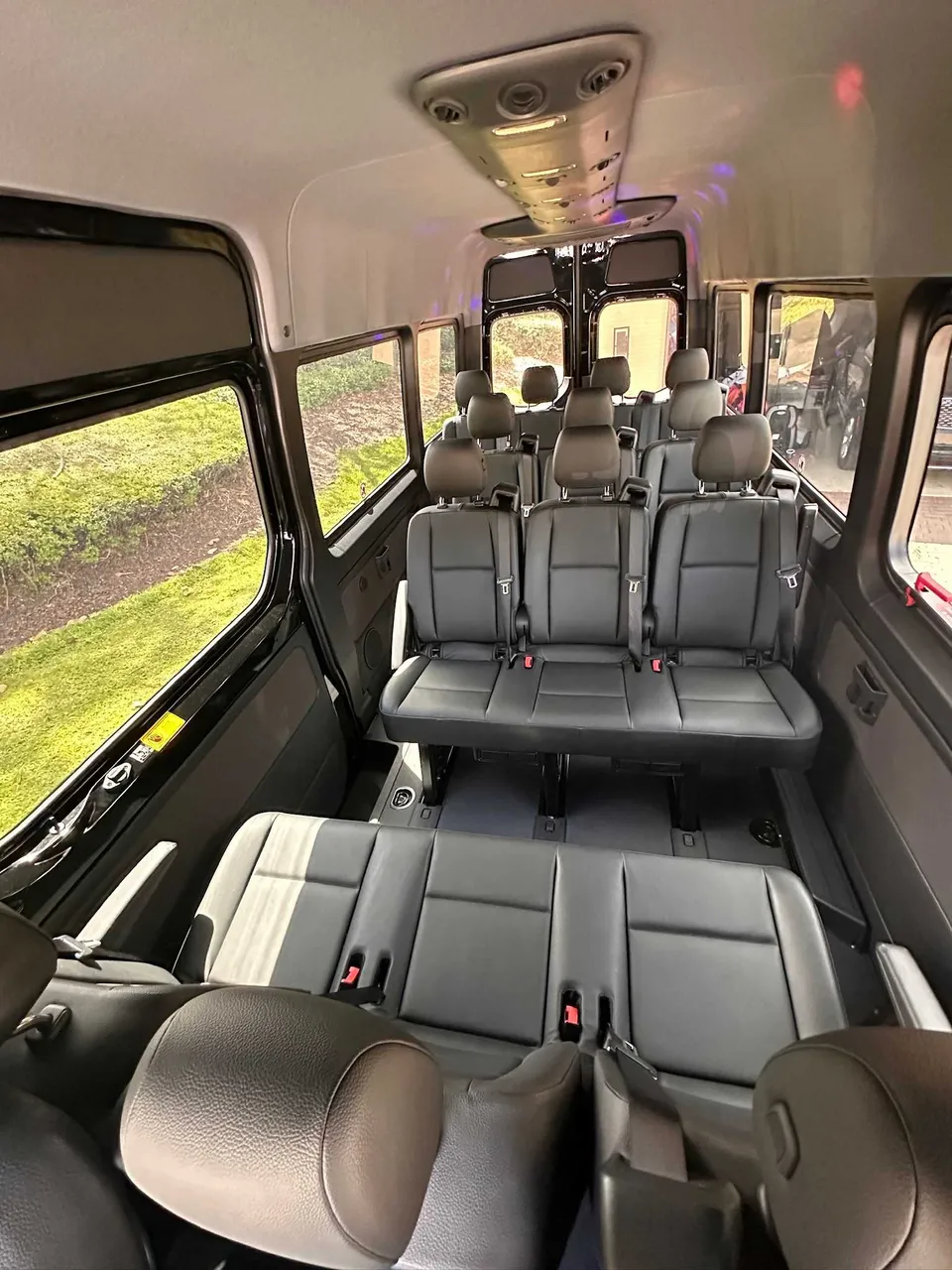 Mercedes Limo Sprinter interior with passenger seat belts for party bus rental