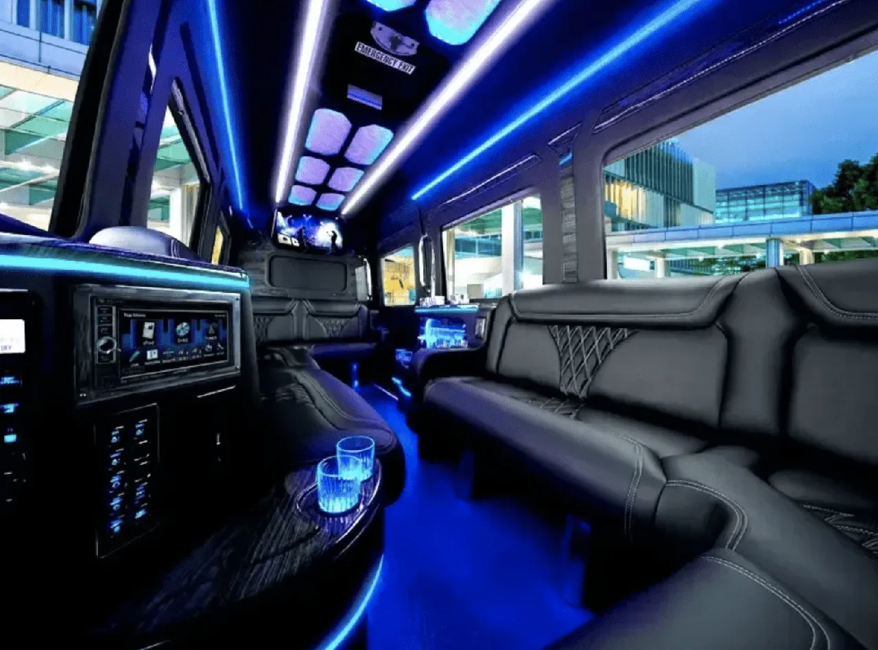 Mercedes Limo Sprinter interior with sofa-style seating, LED accent lighting and LED ceiling lighting for party bus rental