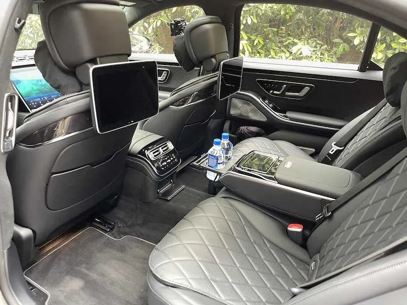 Mercedes S Class interior with rear passenger controls and rear-seat entertainment screens for wedding car rental