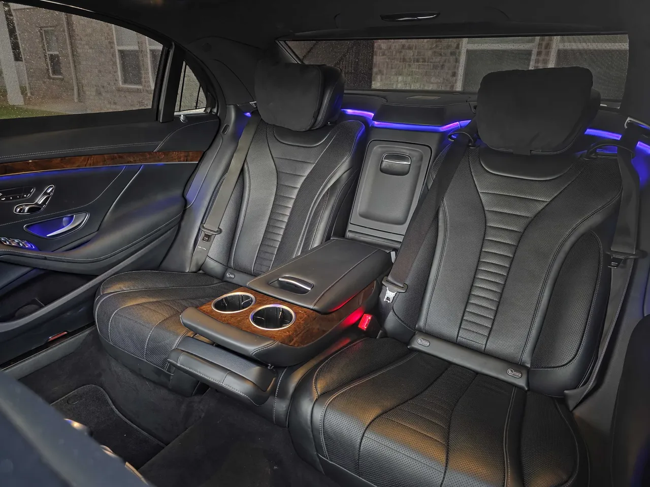 Mercedes S550 'Duchess' interior with cup holders and LED accent lighting for wedding car rental