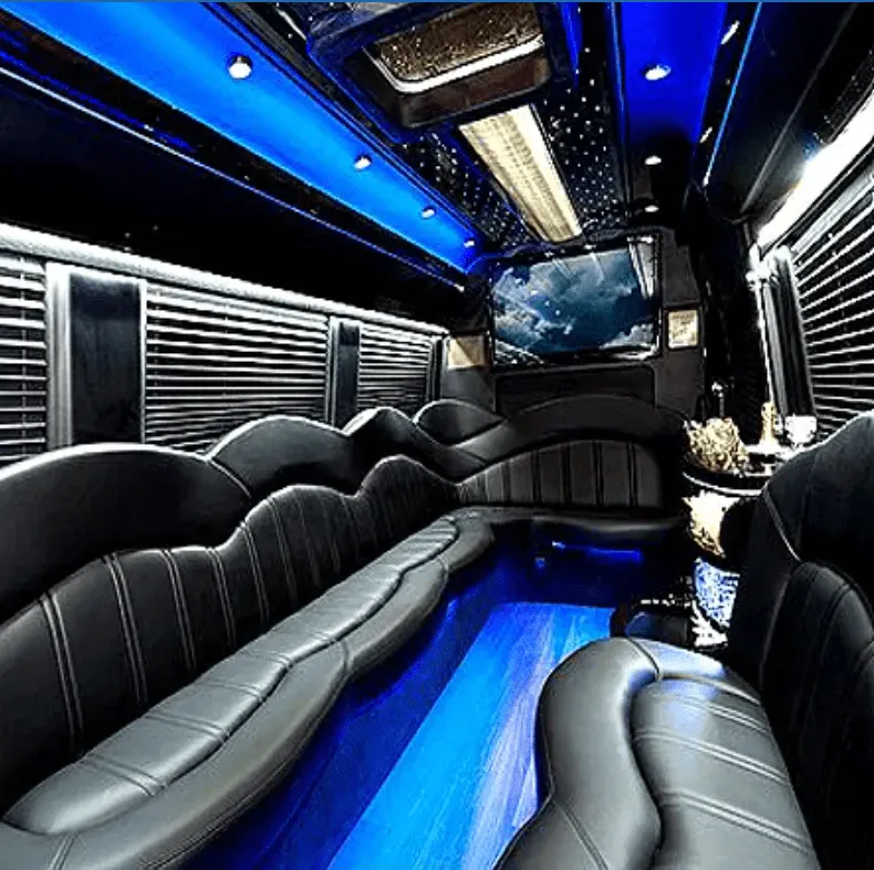 Mercedes Sprinter Limo interior with perimeter lounge seating, window shades and LED accent lighting for party bus rental