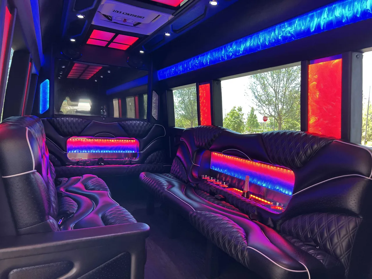 Mercedes Sprinter Limo interior with sofa-style seating, LED accent lighting and LED ceiling lighting, photo 2 for party bus rental