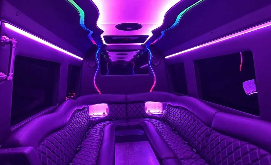 Mercedes Sprinter Limo Mercedes Sprinter Limo interior with perimeter lounge seating and LED accent lighting for party bus rental
