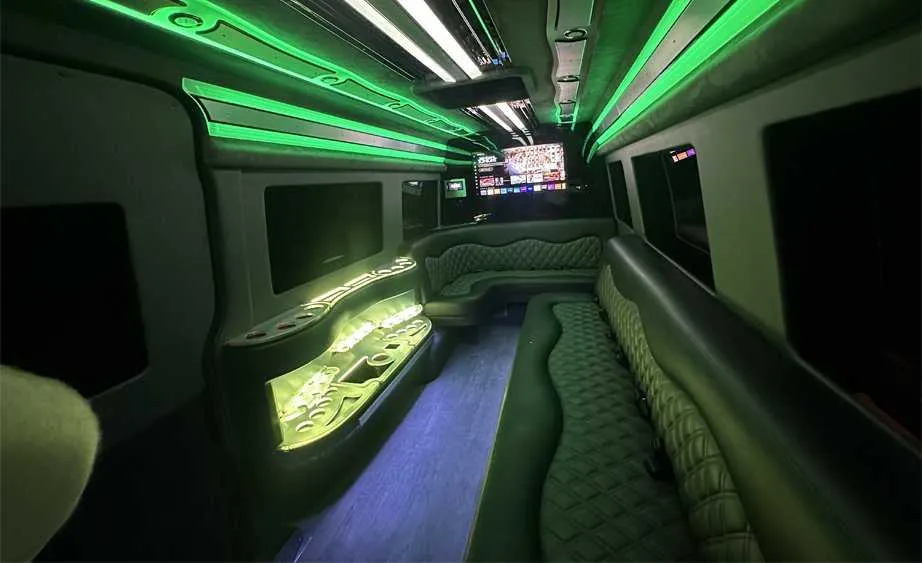 Mercedes Sprinter Limo interior with perimeter lounge seating, LED accent lighting and bar area, photo 4 for party bus rental