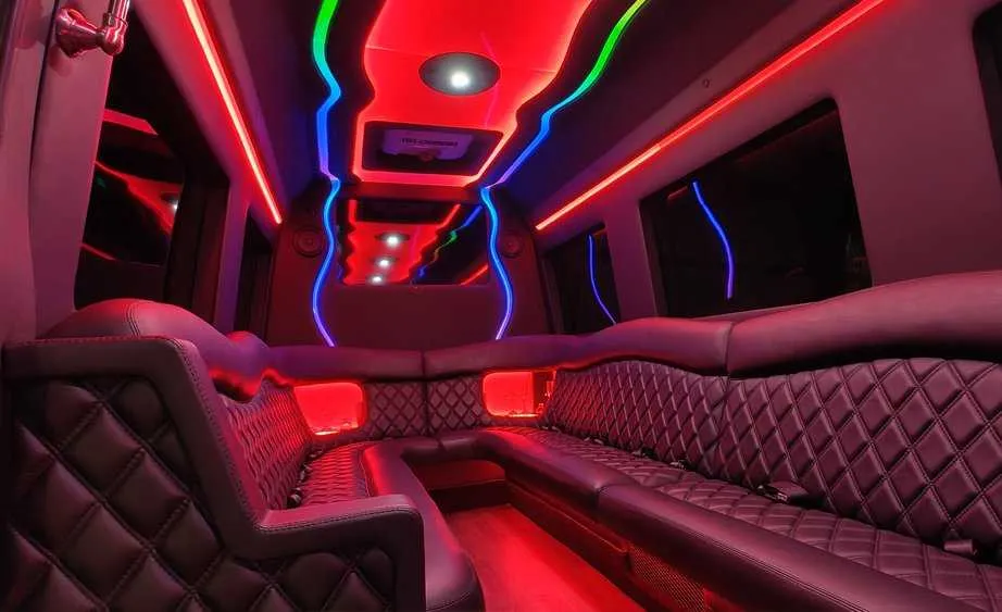 Mercedes Sprinter Limo interior with perimeter lounge seating and LED accent lighting, photo 5 for party bus rental