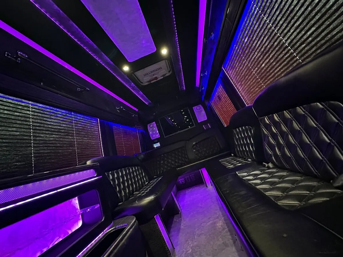 Mercedes Sprinter XL interior with perimeter lounge seating, window shades and LED accent lighting, photo 4 for party bus rental