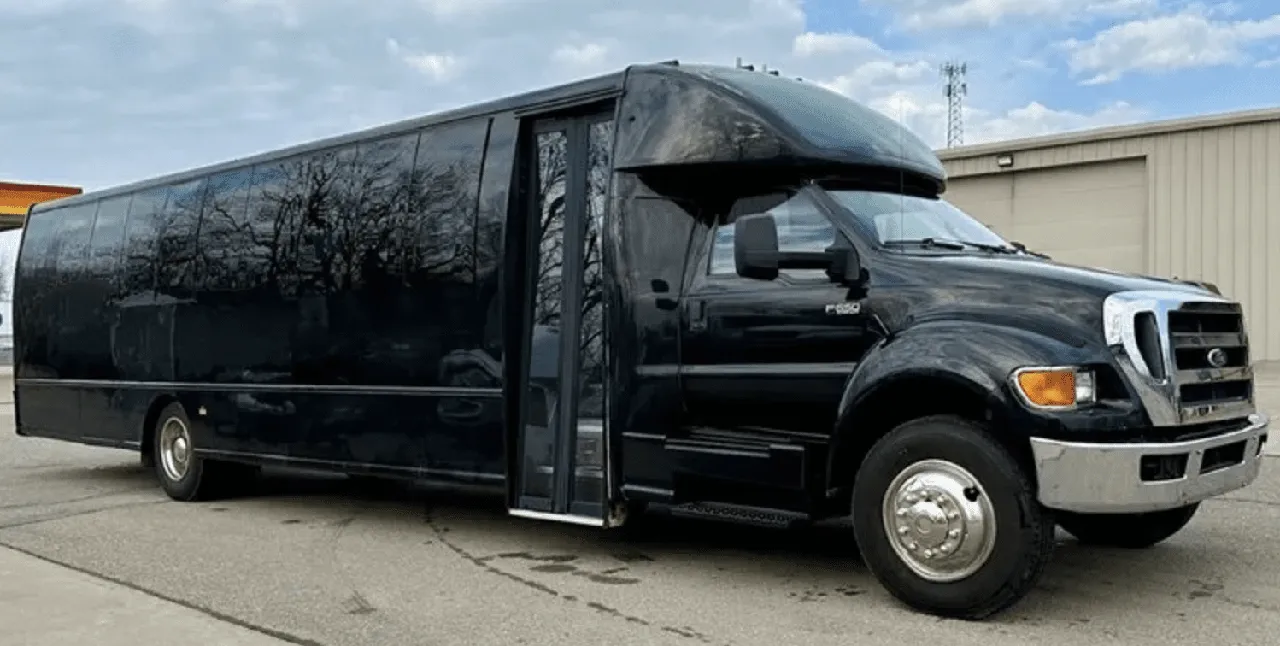 Black 20 Passenger Party Bus with tinted windows for party bus rental
