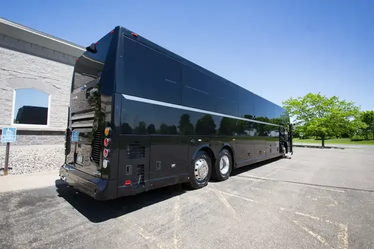 56 Passenger Motorcoach Black 56 Passenger Motorcoach with tinted windows for charter bus rental